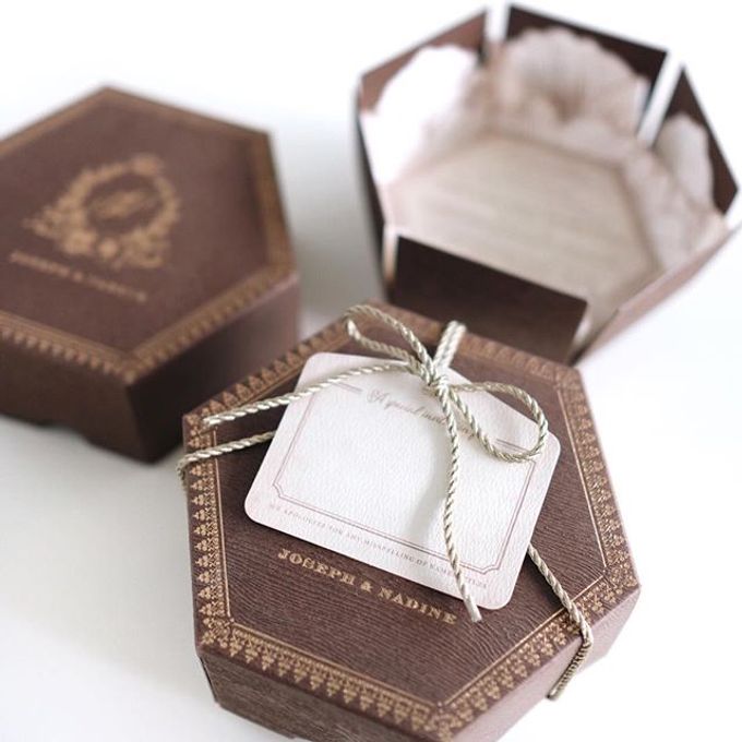 A flower themed holy matrimony invitation wrapped neatly in a hexagonal box for Joseph & Nadine by Tapestry Invitation - 001 A flower themed holy matrimony invitation wrapped neatly in a hexagonal box for Joseph & Nadine by Tapestry Invitation - 001