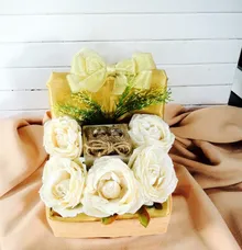 rings box with scattered flowers  by DNY Creative